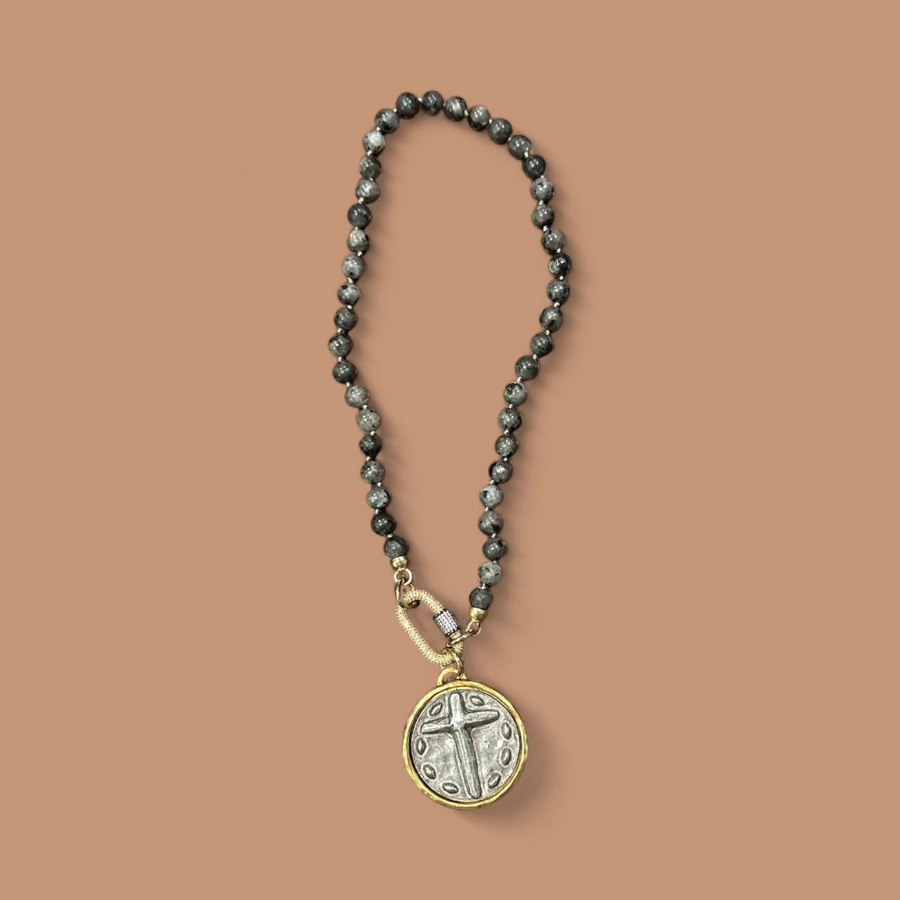 Cross pendant with dark gray glass pearls